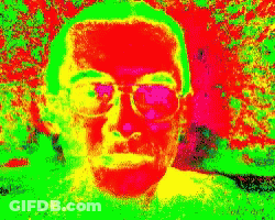 Close Up Man With Glasses Colorful Background GIF