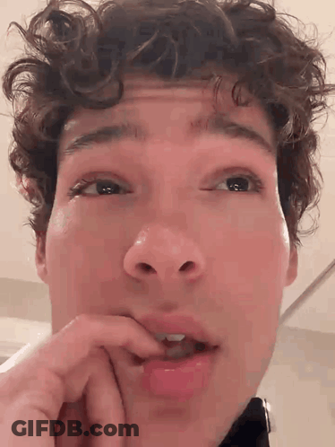 Close Up Man With Hand On Mouth GIF