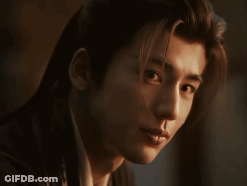 Close-Up Man With Long Hair Looking At Camera GIF