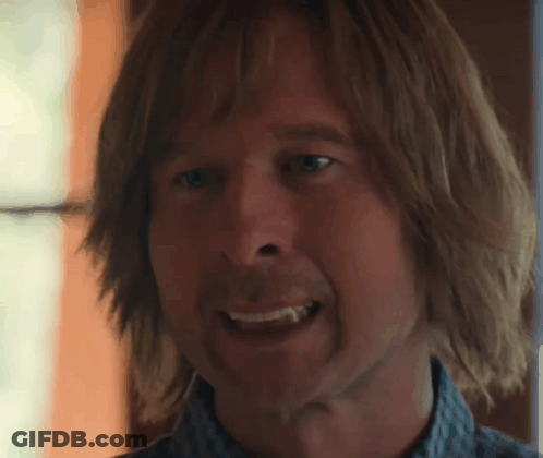 Close Up Man With Long Hair Showing Tooth GIF