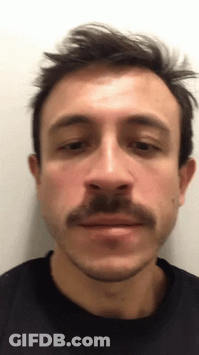 Close Up Man With Mustache In Black Shirt GIF