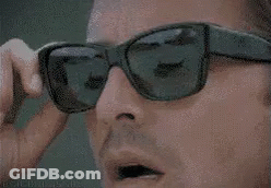 Close Up Man With Sunglasses And Lighter GIF