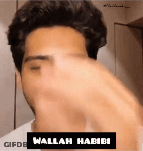 Close Up Man With Wallah Habibi Sign GIF