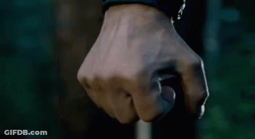 Close Up Of A Fist Against Dark Background GIF