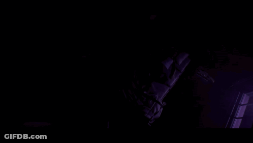 Close-Up Of A Woman's Eyes With Dark Background GIF
