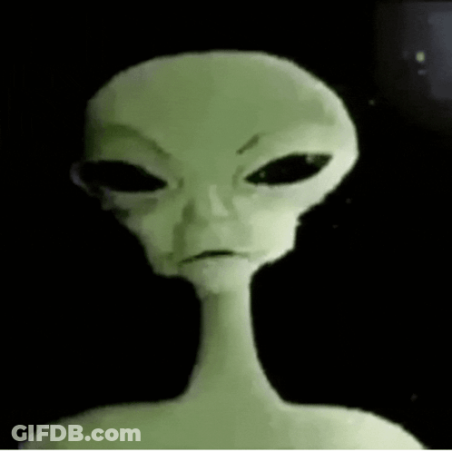 Close Up Of Alien Face With Black Eyes GIF