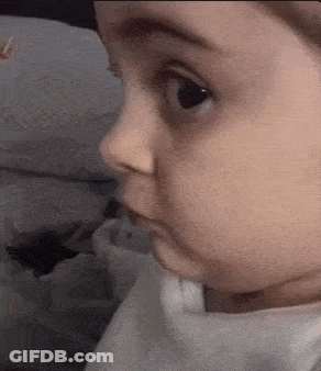 Close Up Of Baby Face Looking GIF