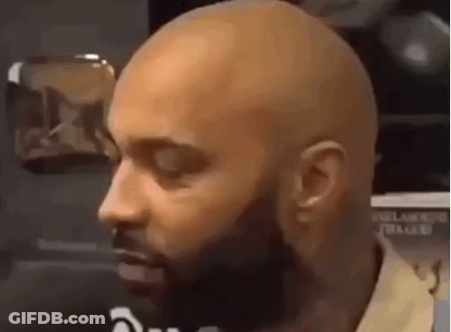 Close-Up Of Bald Bearded Man GIF