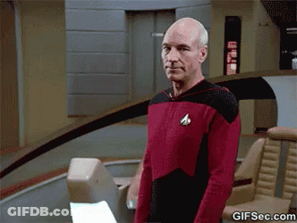 Close Up Of Bald Man Face Dark Background GIF