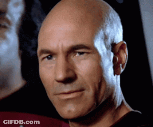 Close Up Of Bald Man Looking At Camera GIF