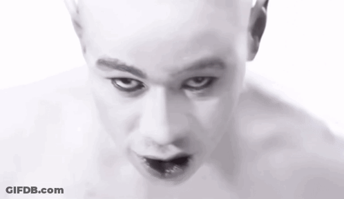 Close Up Of Bald Man With Black Eye GIF