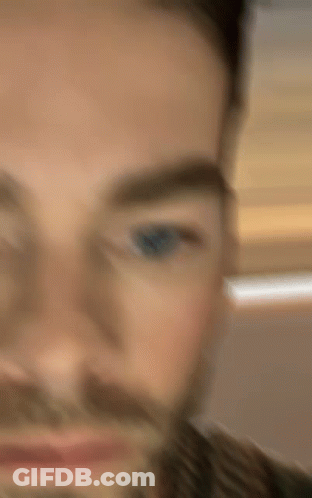 Close Up Of Bearded Man With Blue Eyes GIF