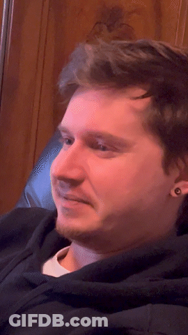 Close Up Of Bearded Man With Ear Piercings GIF