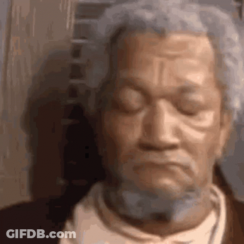 Close Up Of Bearded Old Man Statue GIF