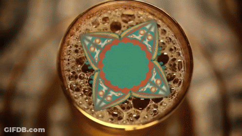 Close Up Of Beer Glass With Floral Design GIF