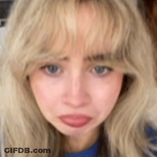 Close-Up Of Blonde Woman With Blue Eyes GIF