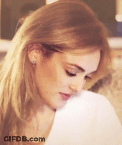 Close Up Of Blonde Woman With Earrings GIF