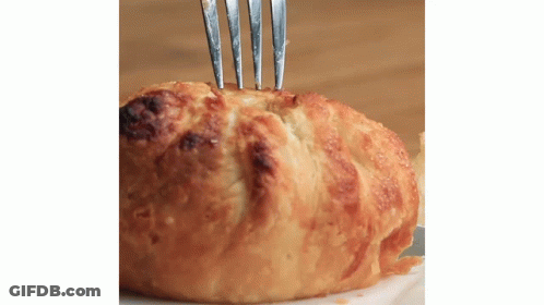Close Up Of Bread With Fork GIF