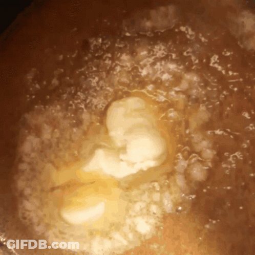 Close Up Of Brown Liquid With Bubbles GIF