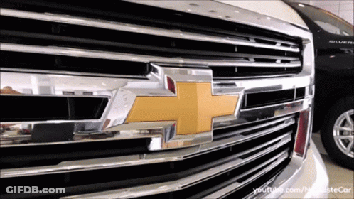 Close Up Of Chevrolet Grill With Yellow Cross GIF
