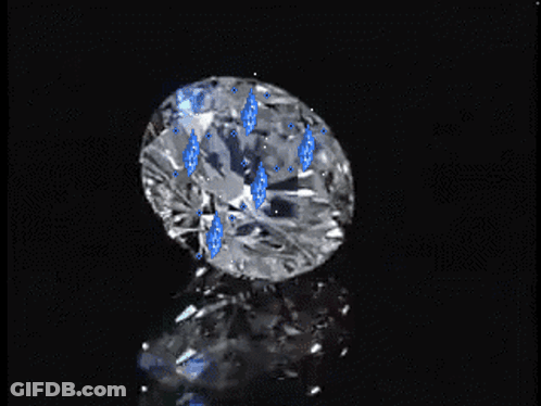 Close Up Of Diamond With Blue Spots GIF
