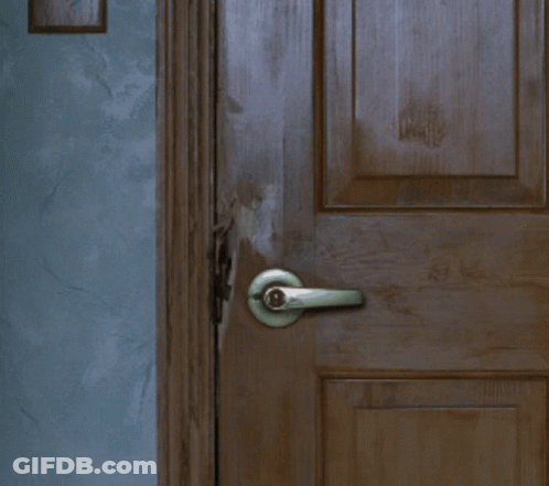 Close Up Of Door With Handle And Blue Wall GIF