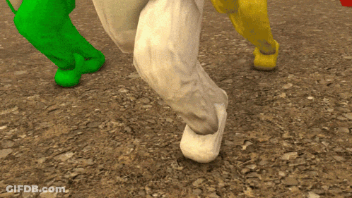Close Up Of Feet In Green Socks And Yellow Shoes GIF
