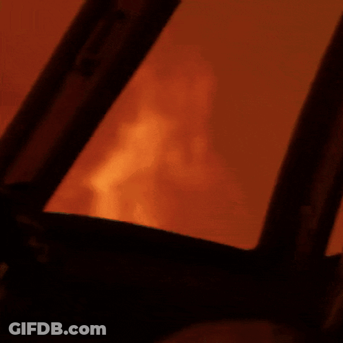 Close Up Of Fire Through Window GIF
