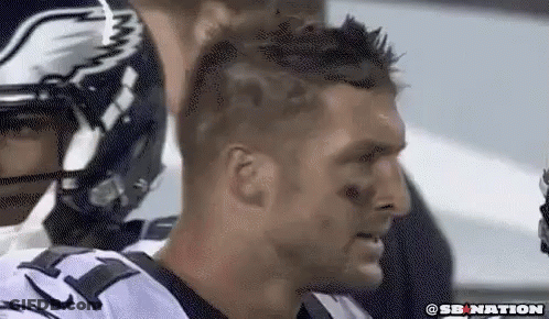 Close Up Of Football Player In Helmet And Jersey GIF