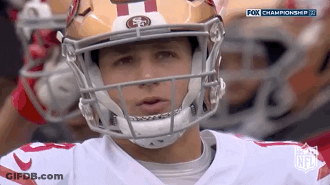 Close Up Of Football Player Wearing Helmet On Field GIF