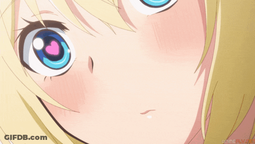 Close-Up Of Girl's Blue Eyes With Pink Heart GIF