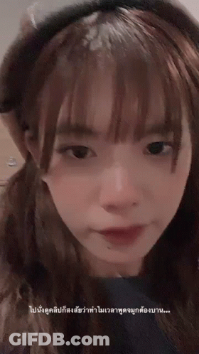 Close Up Of Girl's Face With Foreign Language Below GIF