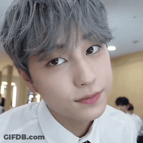 Close-Up Of Gray-Haired Person In White Shirt GIF