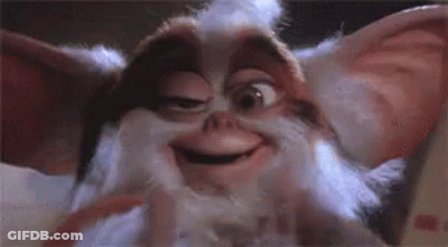 Close Up Of Gremlin Smiling With Eyes Closed GIF
