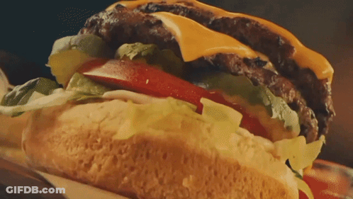 Close Up Of Hamburger With Lettuce And Tomatoes GIF