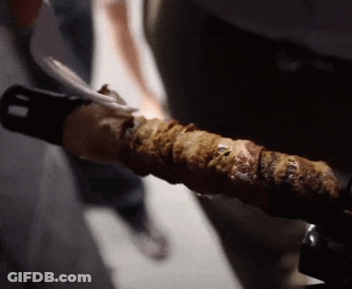 Close Up Of Hand Holding Sword GIF