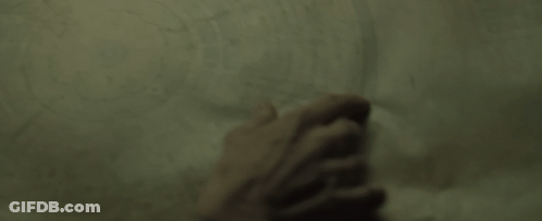Close Up Of Hand Pointing At Paper GIF