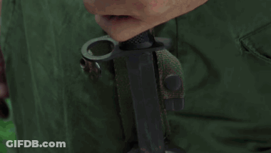 Close Up Of Hands Holding Green Bag GIF