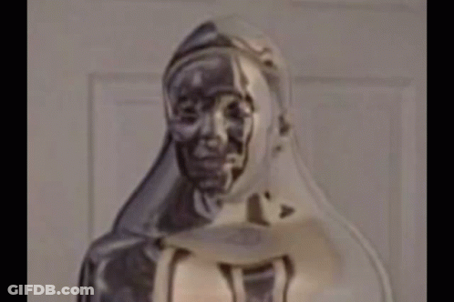 Close Up Of Hooded Woman Statue GIF