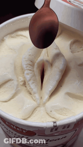 Close Up Of Ice Cream Container With Spoon GIF