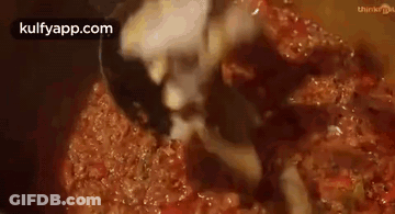 Close-Up Of Ladle In Pot Of Sauce GIF