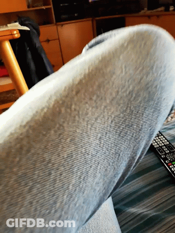 Close Up Of Leg With Remote Control GIF