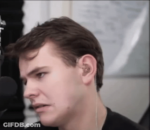 Close Up Of Man Face With Ear Buds GIF
