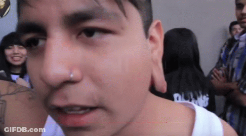 Close Up Of Man In Black Shirt Saying Punk GIF