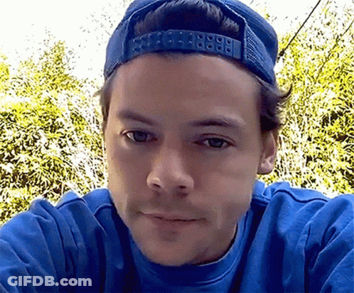 Close Up Of Man In Blue Hat And Blue Sweatshirt GIF
