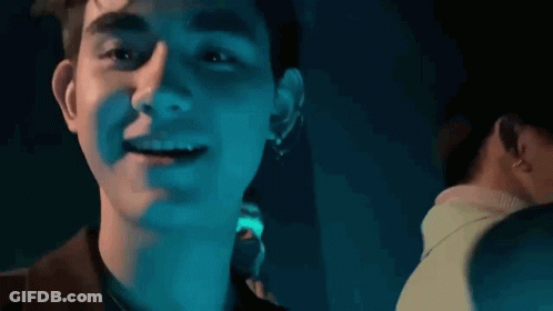 Close Up Of Man In Dark Room With Blue Light GIF