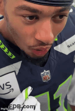 Close Up Of Man In Seahawks Uniform GIF