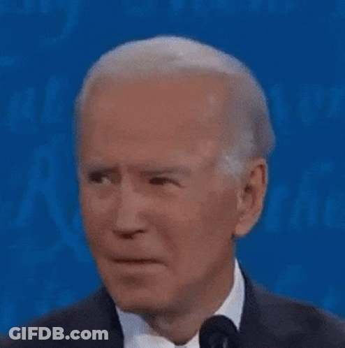 Close Up Of Man In Suit Making Funny Face On Blue Background GIF