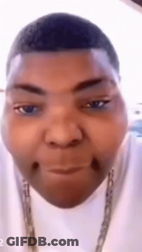 Close Up Of Man In White Shirt And Chain GIF