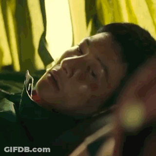 Close Up Of Man Laying On Bed With Eyes Closed And Mouth Open GIF